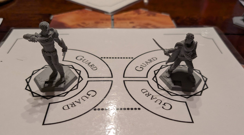 Photograph of two 3d-printed miniatures