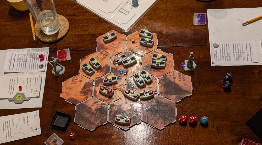 Photograph of a table set for roleplay with character sheets, miniatures, dice, and pencils
